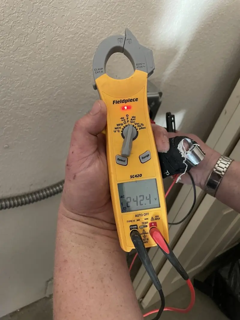 Voltage testing with clamp meter during Electrical Installation Services in Fayetteville